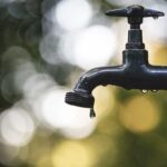 Water from a faucet.